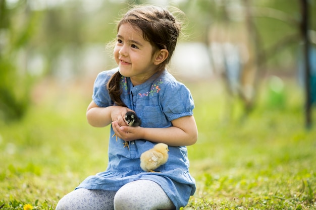 Cute girl with chicken