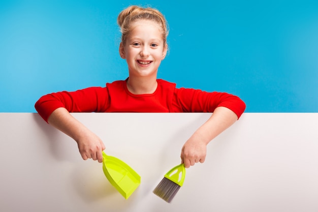 Cute girl with a lime scoop and brush