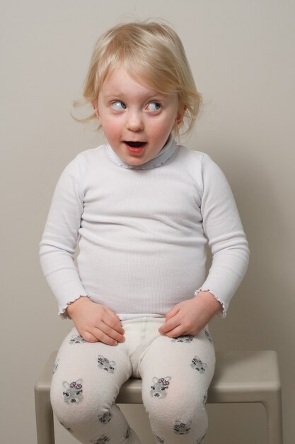 Cute girl  year old having fun and playing in studio