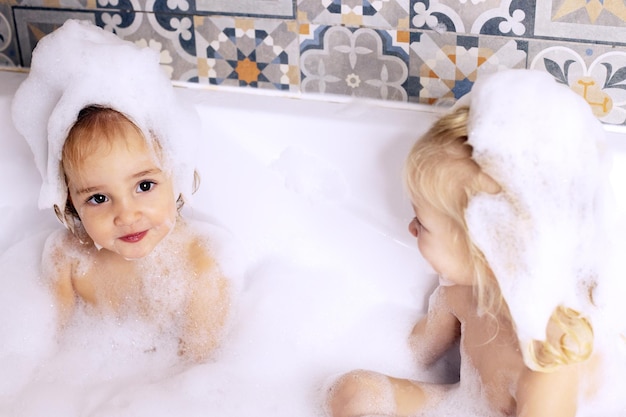 Cute girls bathing in bathtub