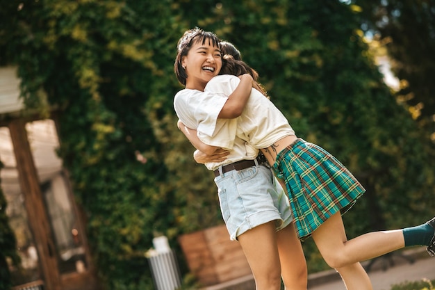 Cute girls hugging and feeling happy