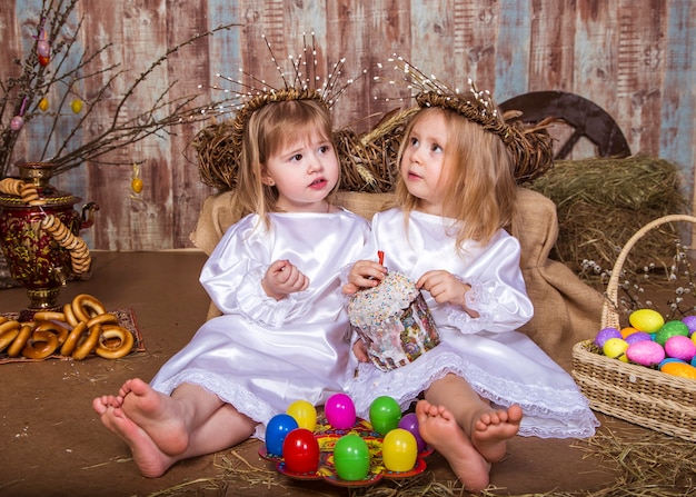 Cute girls play with real rabbit and duckling