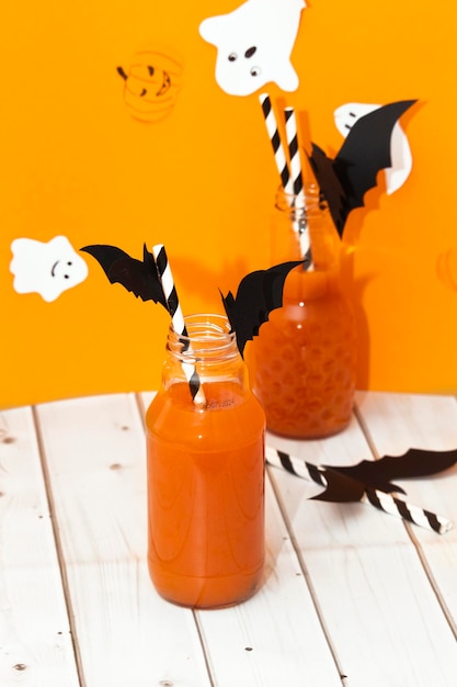 Cute Halloween pumkin juice drinks for a kids party Decor drinks for Halloween