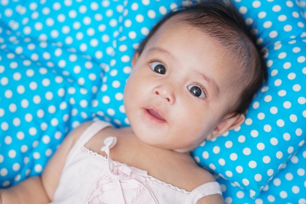 cute happy baby in bed