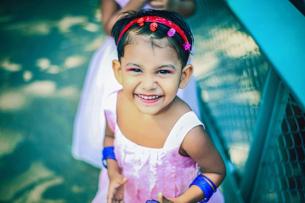 Cute happy face baby girl looking at camera