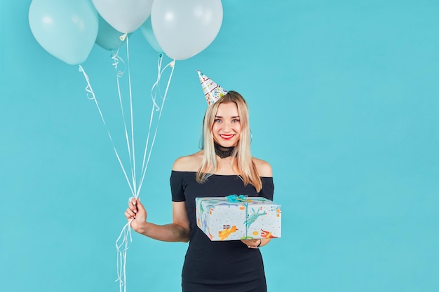 Cute happy young girl celebrating birthday party