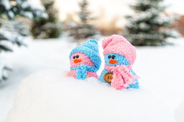 Cute homemade snowmen with scarves and hats Winters Tale Greeting card with copy space Winter background