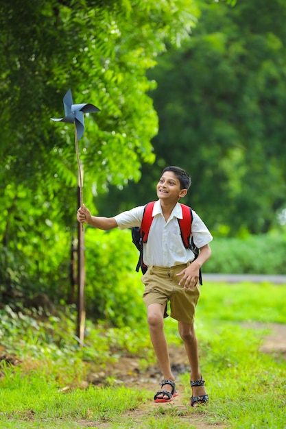 Cute indian child holding a pinwheel