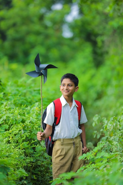 Cute indian child holding a pinwheel