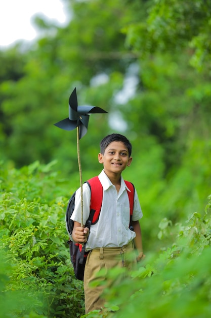 Cute indian child holding a pinwheel