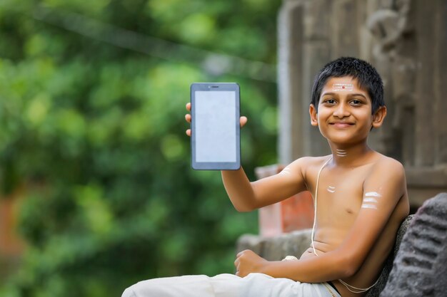 Cute indian child with tablet