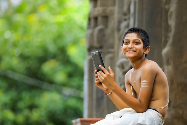 Cute indian child with tablet