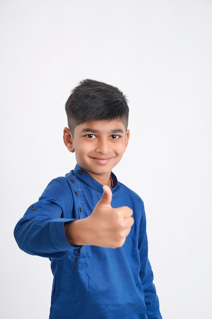 Cute indian little boy showing thumps up