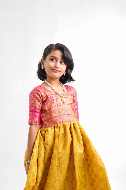 Cute indian little girl giving expression on white background