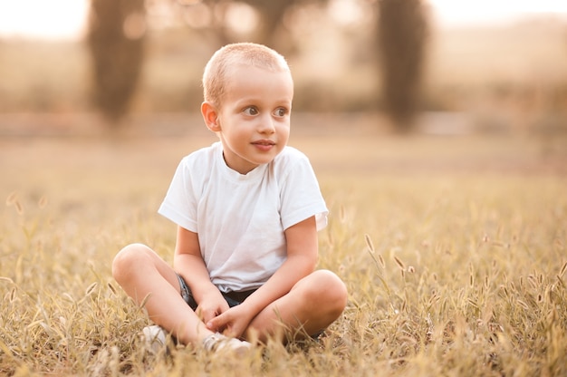 Cute kid boy wearing casual white tshirt