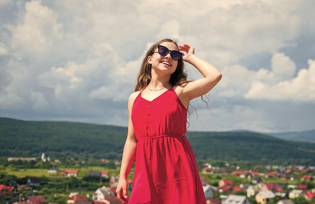 Cute kid in dress and glasses outdoor summer fashion