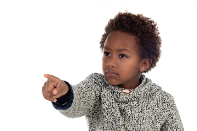 Cute kid pointing with his finger at camera