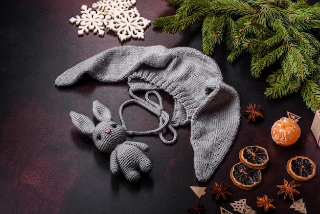 Cute knitted gray hat with ears for a small baby