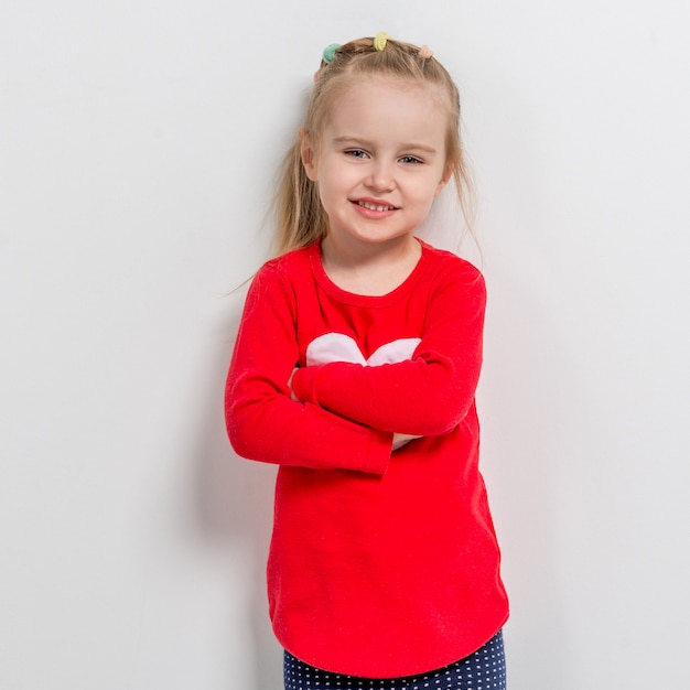 Cute laughing girl in red sweater