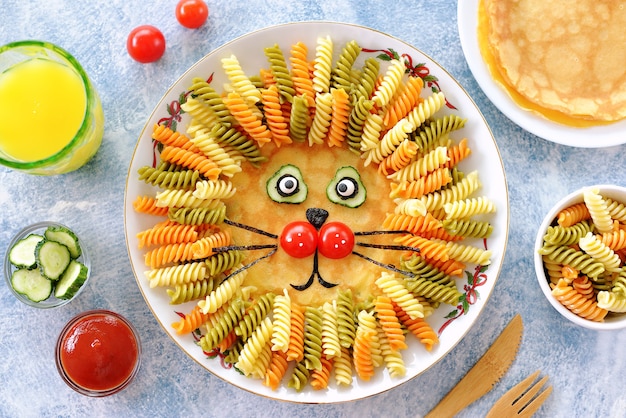 Cute lion from pancakes, pasta, and vegetables