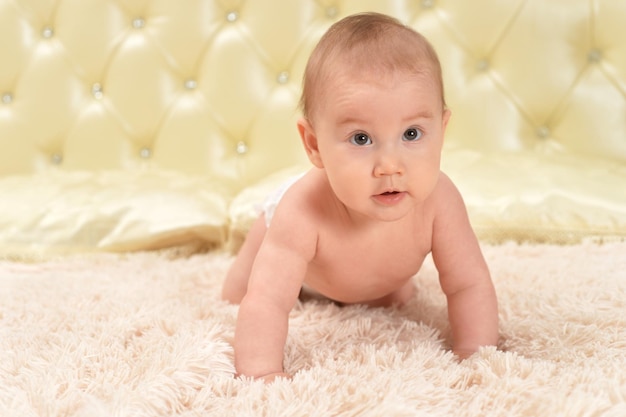 Cute little baby girl on bed