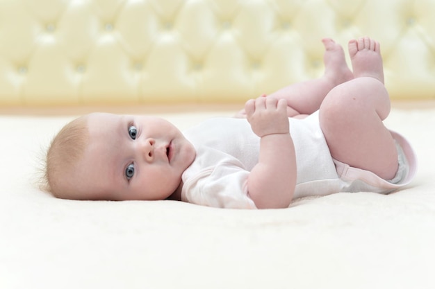 Cute little baby girl looking at the camera