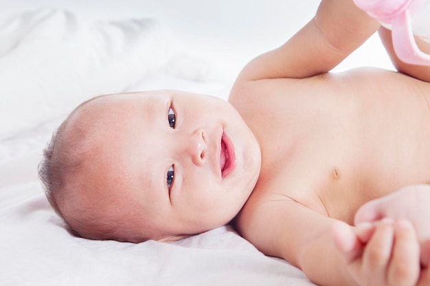 Cute little baby girl smiling at the camera