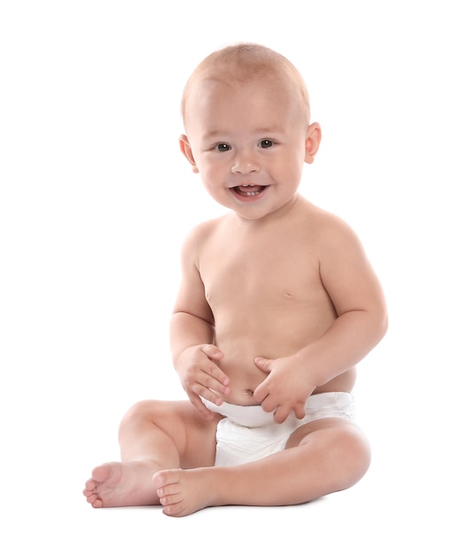 Cute little baby sitting on white background