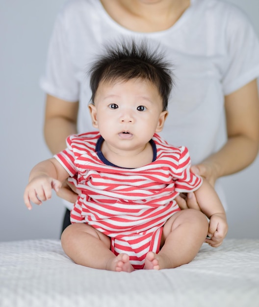 Photo cute of little baby sitting