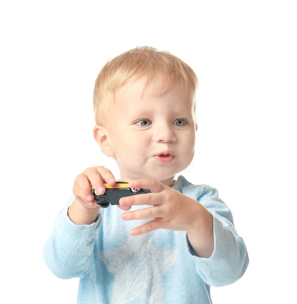 Cute little baby with toy on white background