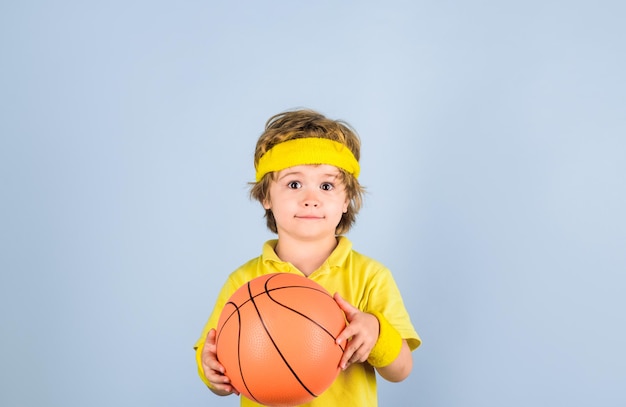 Cute little basketball player training children and sport little basketball player in sportswear