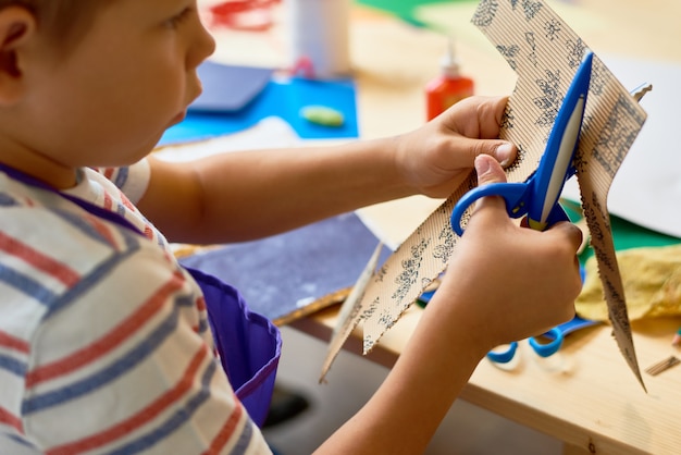 Cute Little Boy in Craft Class