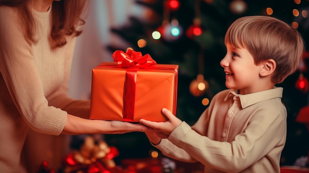 Cute little boy gives a gift to his mother for Christmas