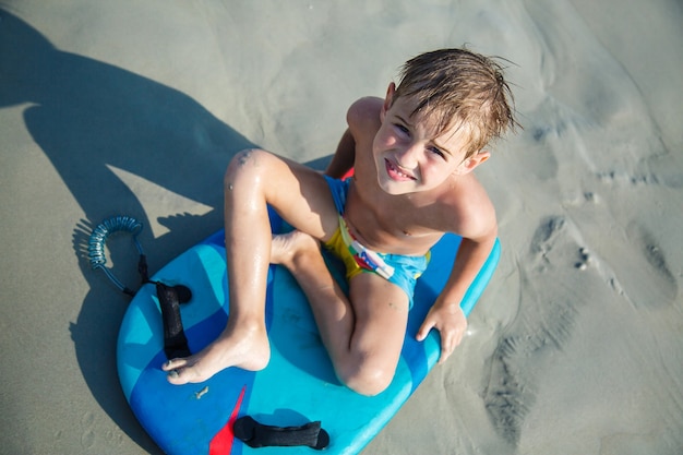 Cute little boy having fun on the seashore