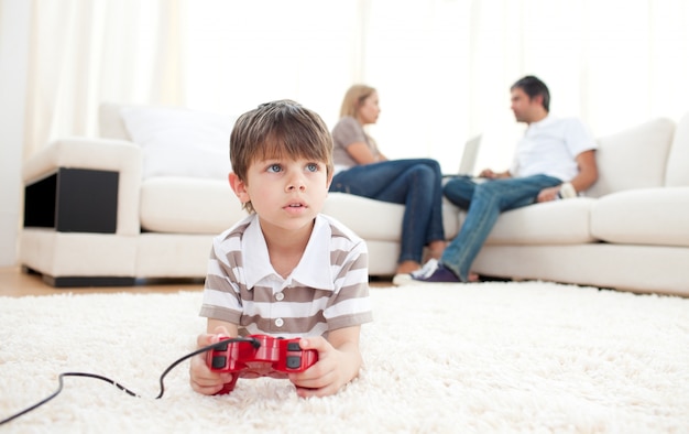 Cute little boy playing video games