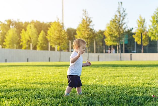 Cute little boy running in the park