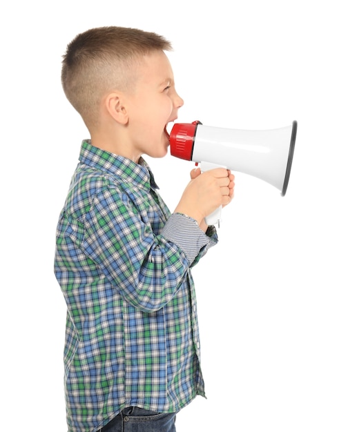 Cute little boy shouting into megaphone on white 