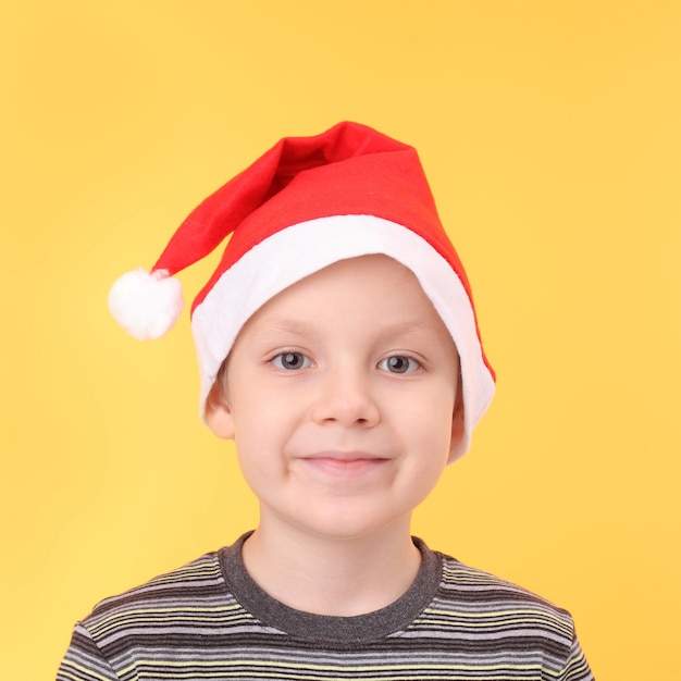 Cute little boy wearing Santa Claus cap