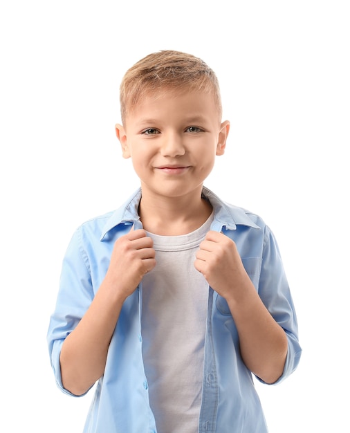 Cute little boy on white surface