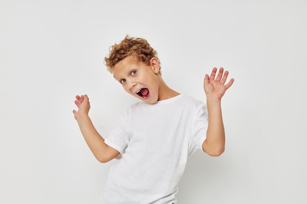 Cute little boy in a white tshirt posing fun Lifestyle unaltered