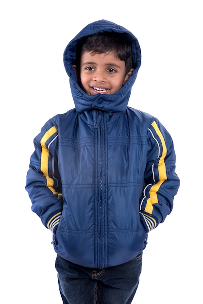 Cute little boy in a winter coat isolated on a white background