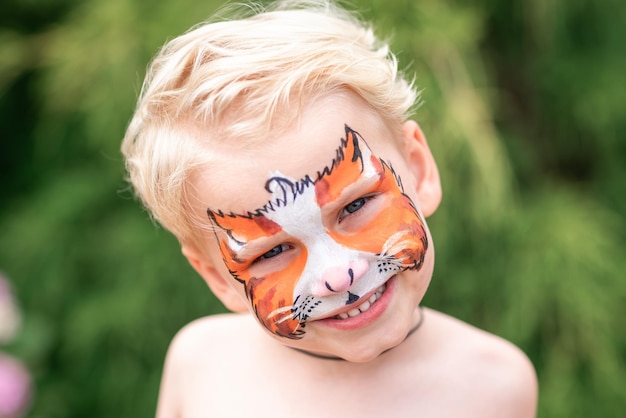 Cute little boy with his face painted