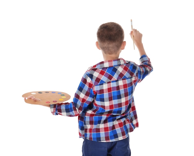 Photo cute little boy with palette and brush for painting on white background