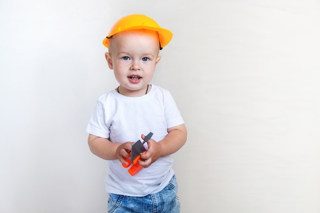 Cute little boy with repairing tools