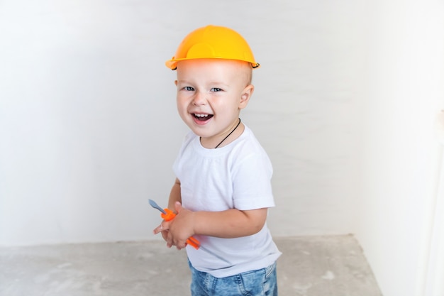 Cute little boy with repairing tools