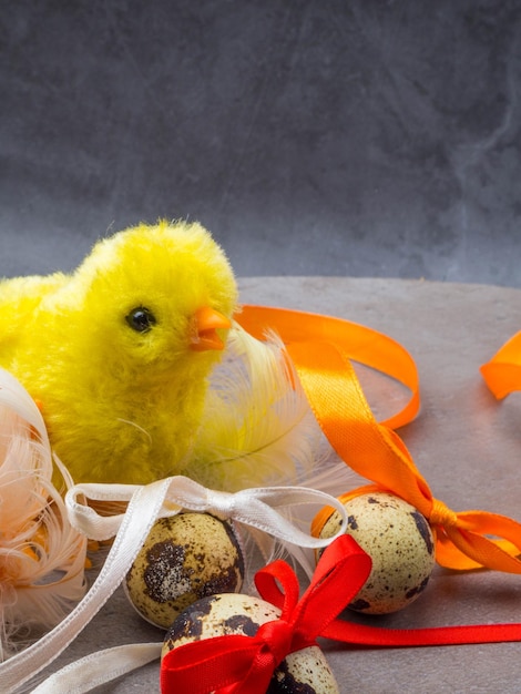 Cute little chicken with eggs isolated on grey background