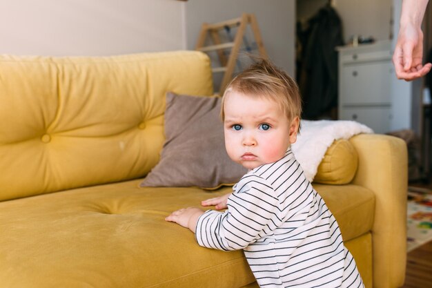 Cute little child is playing at home