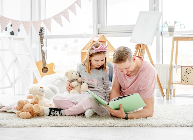 Cute little daughter with happy father