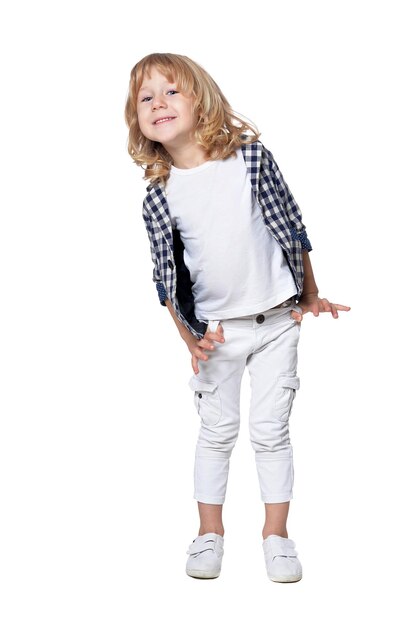 Cute little fashionable boy posing against white background