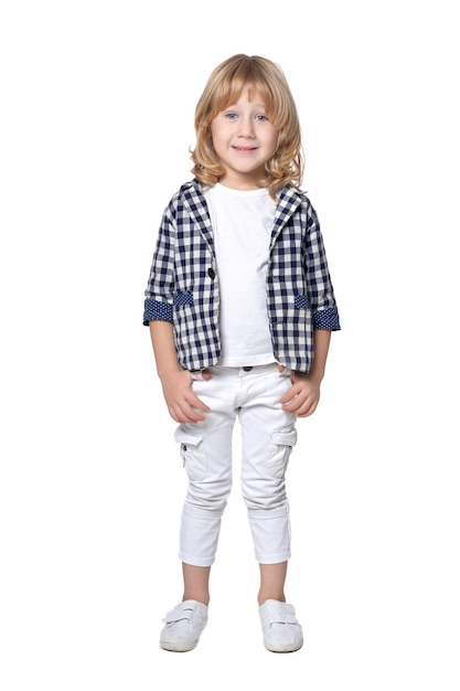 Cute little fashionable boy posing against white background